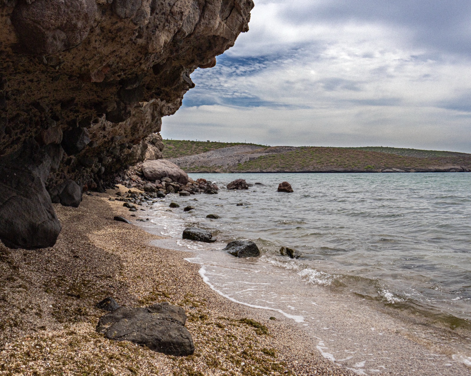 Rocky beach and calm water at Playa Península